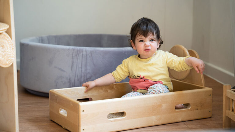 Sunrise Day Nursery - Langley child sitting in the box